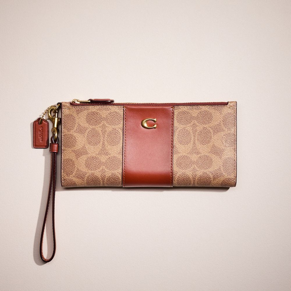 COACH®,RESTORED DOUBLE ZIP WALLET IN SIGNATURE CANVAS,Brass/Tan/Rust,Front View