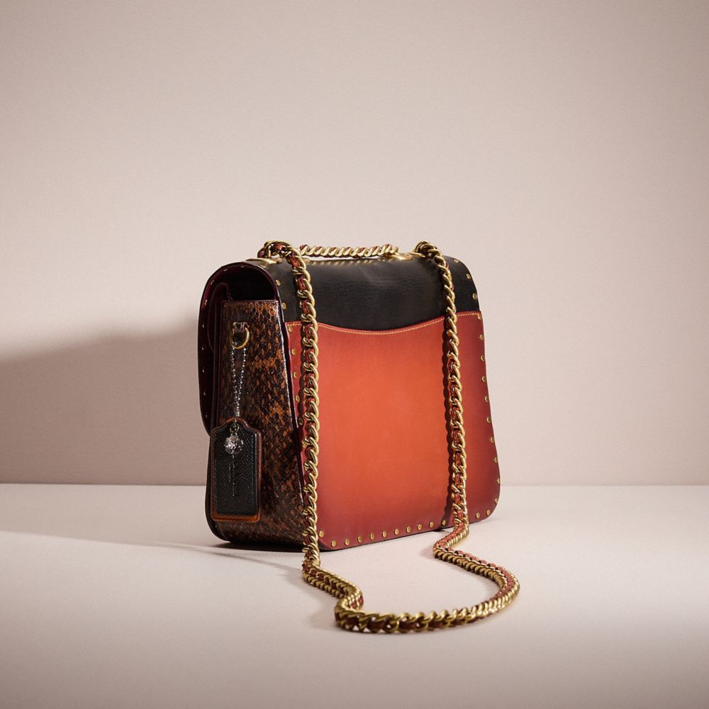COACH®,UPCRAFTED MADISON SHOULDER BAG IN SIGNATURE CANVAS WITH RIVETS AND SNAKESKIN DETAIL,Brass/Tan/Rust,Angle View