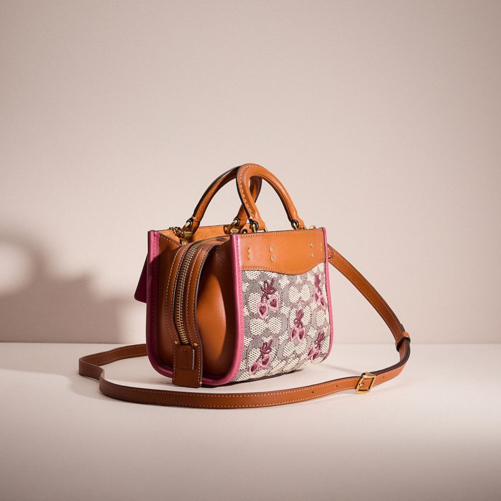 COACH®,UPCRAFTED ROGUE BAG 17 IN SIGNATURE TEXTILE JACQUARD WITH HEART EMBROIDERY,Brass/Cocoa Burnished Amber,Angle View