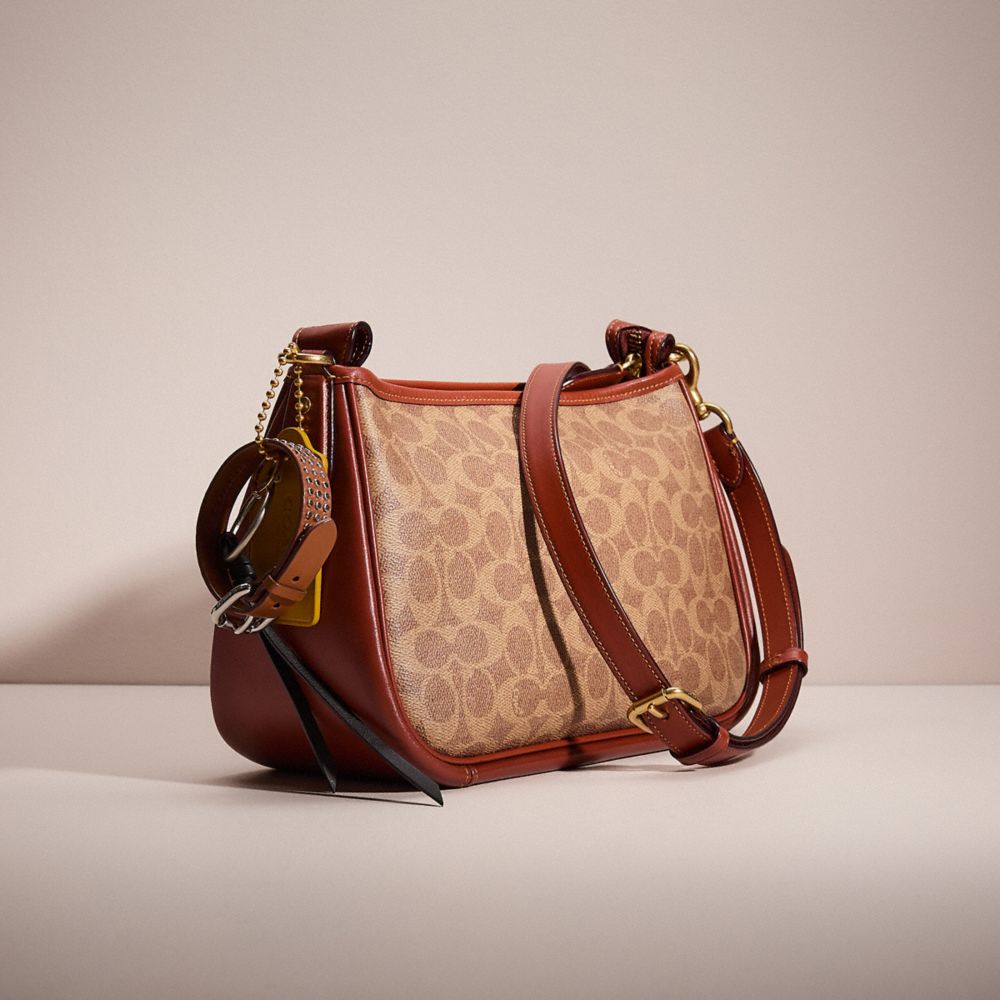 COACH®,UPCRAFTED CARY CROSSBODY IN SIGNATURE CANVAS,Sweet Nostalgia,Brass/Tan/Rust,Angle View