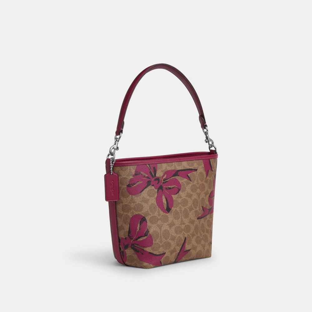 COACH®,City Bucket Bag In Signature Canvas With Bow Print,Canvas,Bucket,Piping,Day Party,Brown,Angle View