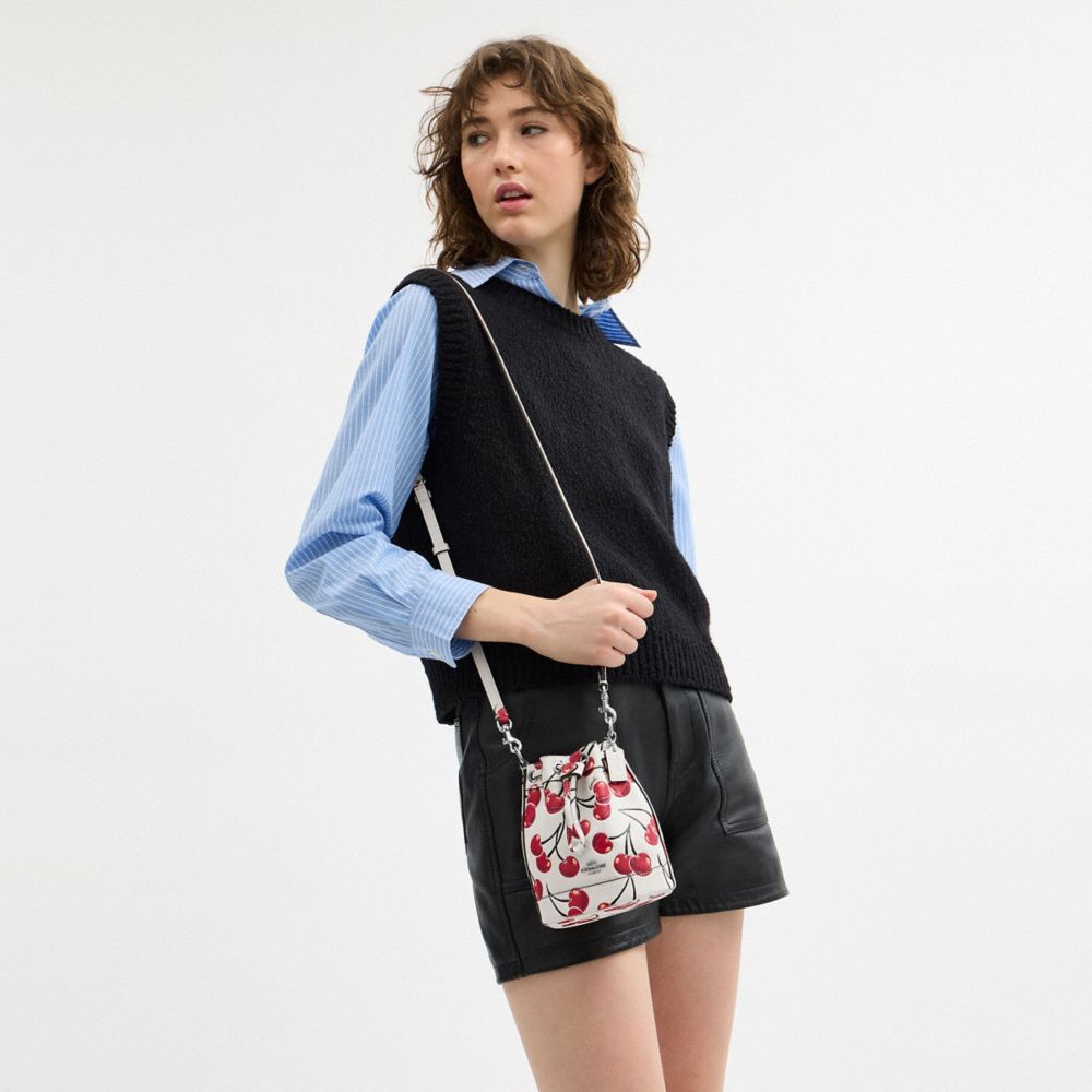 COACH®,Mini Bucket Bag With Cherry Print,Leather,Bucket,Logo,Metal,Word Embellishment,Day Party,White,Detail View