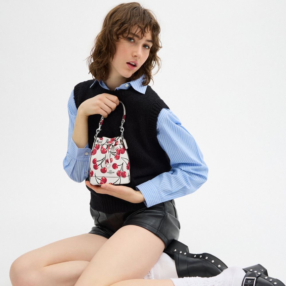 COACH®,Mini Bucket Bag With Cherry Print,Leather,Bucket,Logo,Metal,Word Embellishment,Day Party,White,Detail View