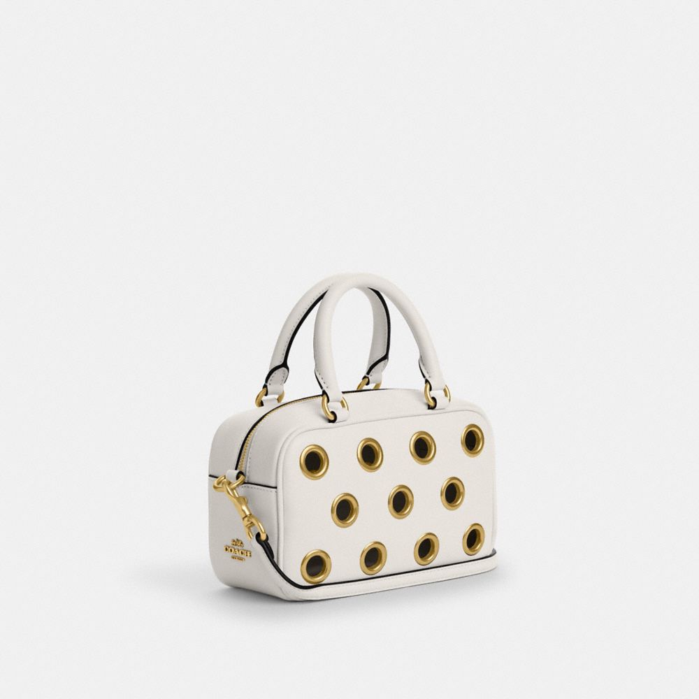 COACH®,Satchel Crossbody Bag With Grommets,Leather,Crossbody,Grommet,Metal,Embossed,Logo,Day Party,White,Angle View