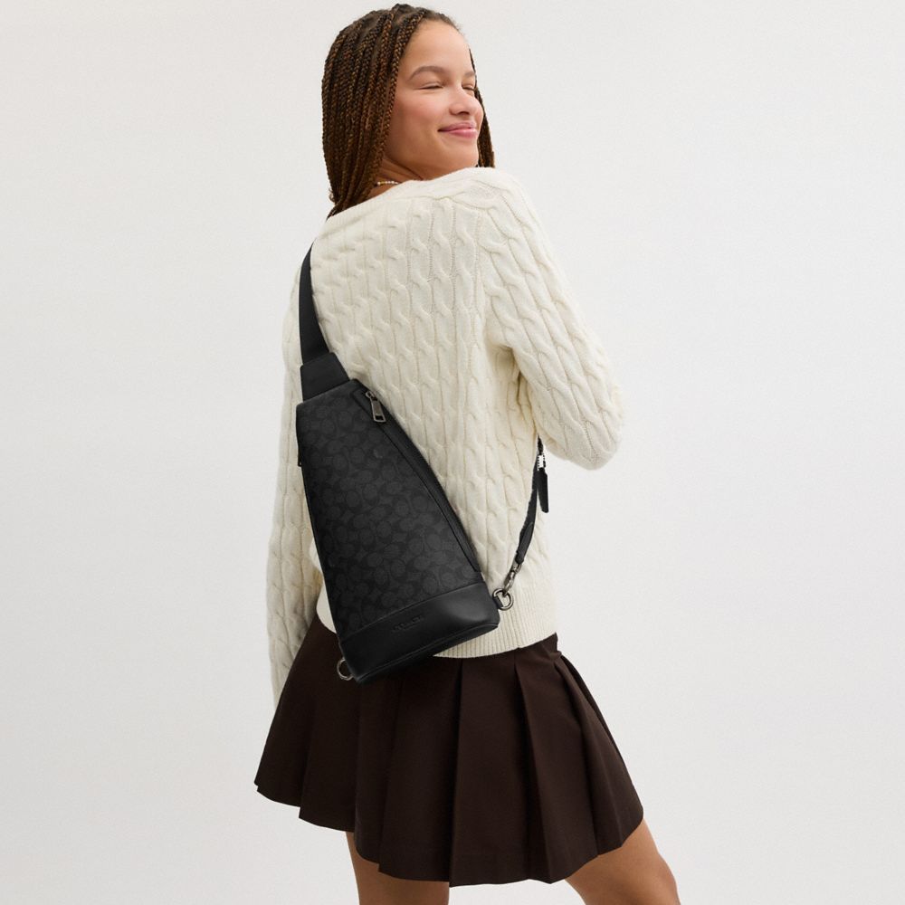 COACH®,Dominic Sling Pack In Signature Canvas,Canvas,Calfskin Leather,Slingback,Adjustable,Casual,Multi Color,Angle View