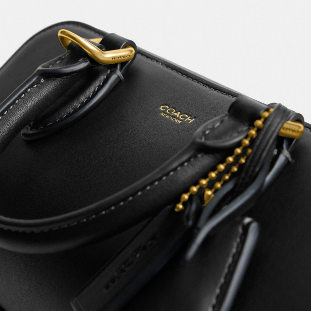 Shop Coach In Brass/black