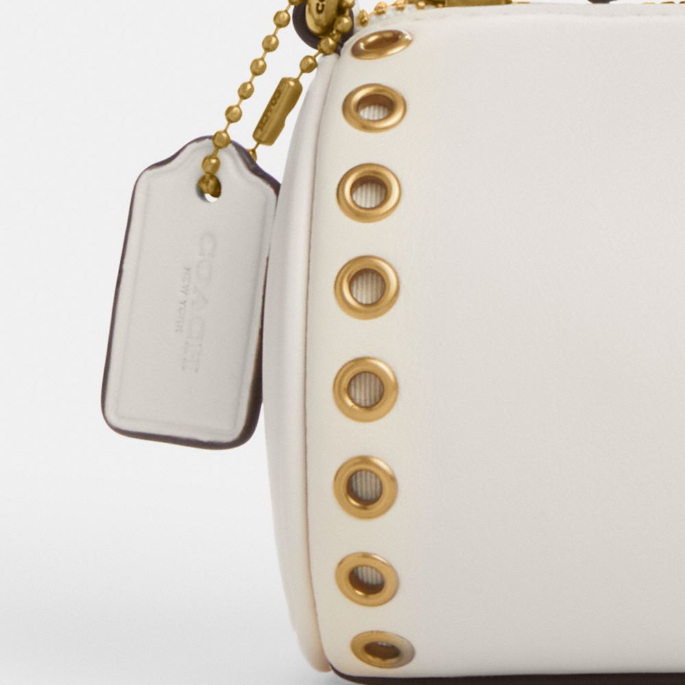 COACH®,SAC CYLINDRIQUE NOLITA AVEC ŒILLETS,Cuir innovant,Laiton/Craie
