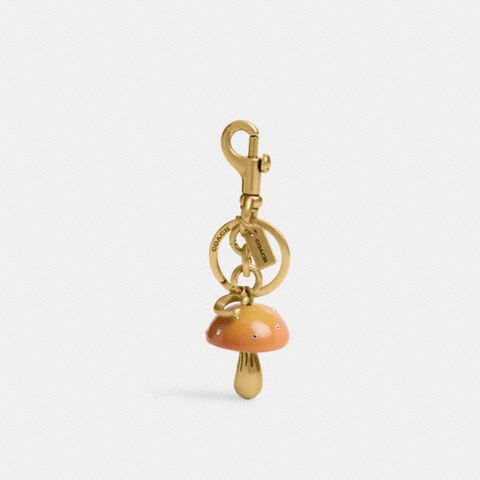 Женский брелок Coach Mushroom Bag Charm, цвет: Латунный / Горчичный