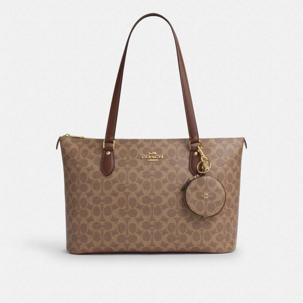 COACH®,Circular Coin Pouch In Signature Canvas,Canvas,Leather,Key Chain,Pouch,Logo,Key Ring,Casual,Brown,Angle View