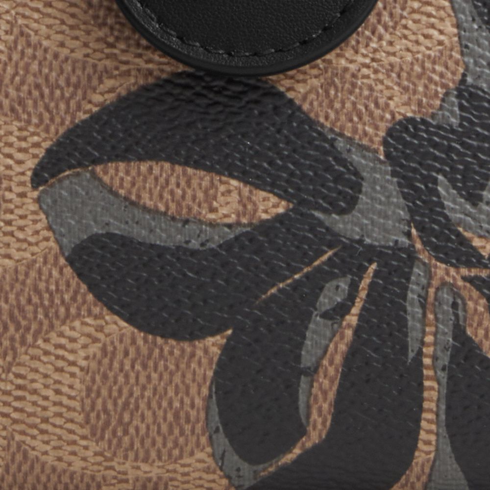 COACH®,Medium Corner Zip Wallet In Signature Canvas With Bow Print,