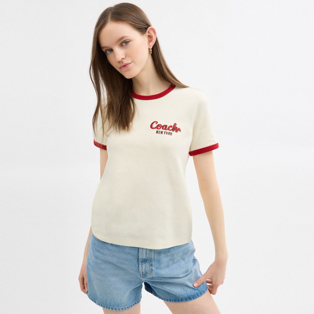 COACH®,New Year Ringer T Shirt In Organic Cotton,Organic Cotton,T Shirt,Logo,Word Embellishment,Piping,Sustainable,Casual,Cream,Scale View