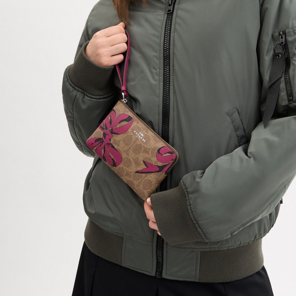 COACH®,Corner Zip Wristlet In Signature Canvas With Bow Print,Canvas,Wristlet,Casual,Brown,Detail View