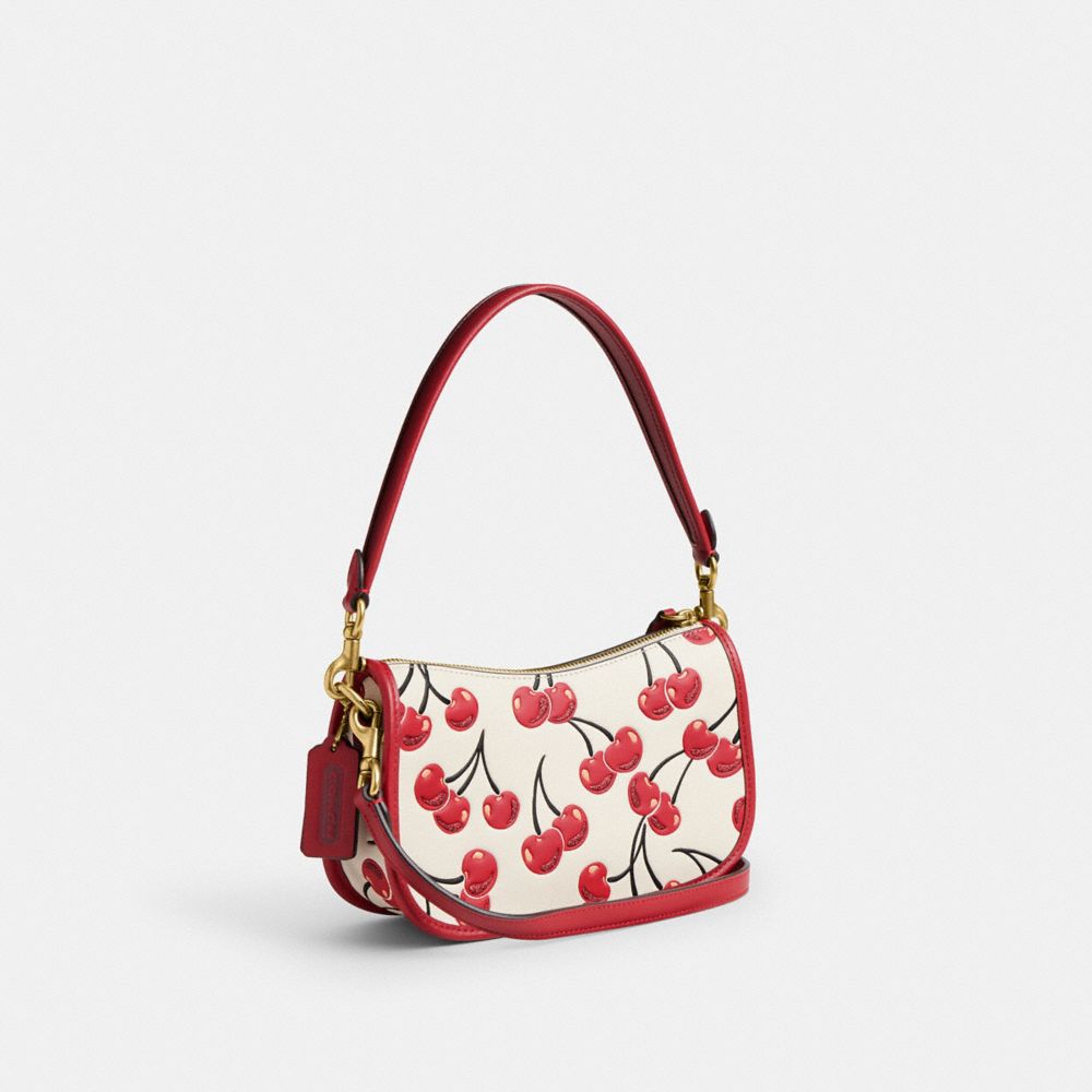 COACH®,Swinger Bag With Cherry Print,,Angle View