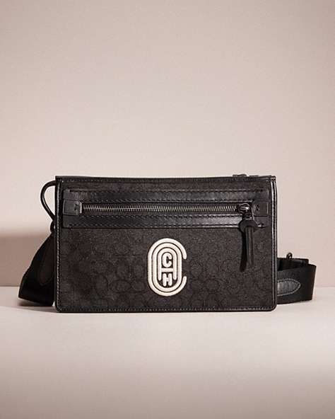 COACH®,RESTORED RIVINGTON CONVERTIBLE POUCH IN SIGNATURE JACQUARD WITH COACH PATCH,Black/Chalk,Front View