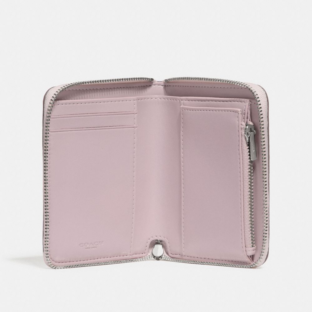 Petit portefeuille zippé avec imprimé floral à nœud