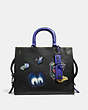 COACH®,DISNEY X COACH ROGUE WITH PATCHES,Leather,Medium,Black Copper/Black,Front View