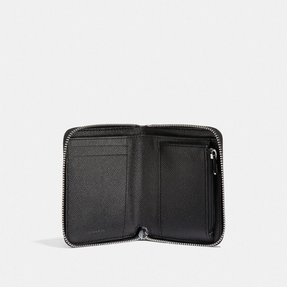 Petit portefeuille zippé en boîte avec paillettes étoilées