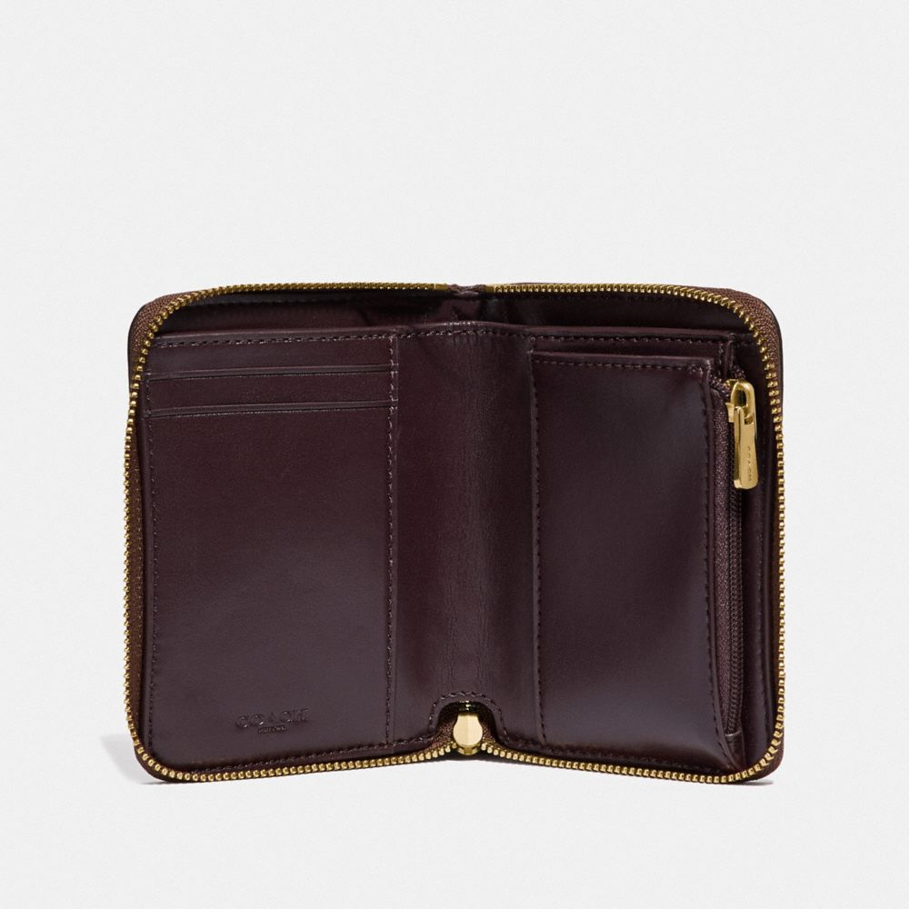 Petit portefeuille zippé Keith Haring en toile emblématique avec patchs