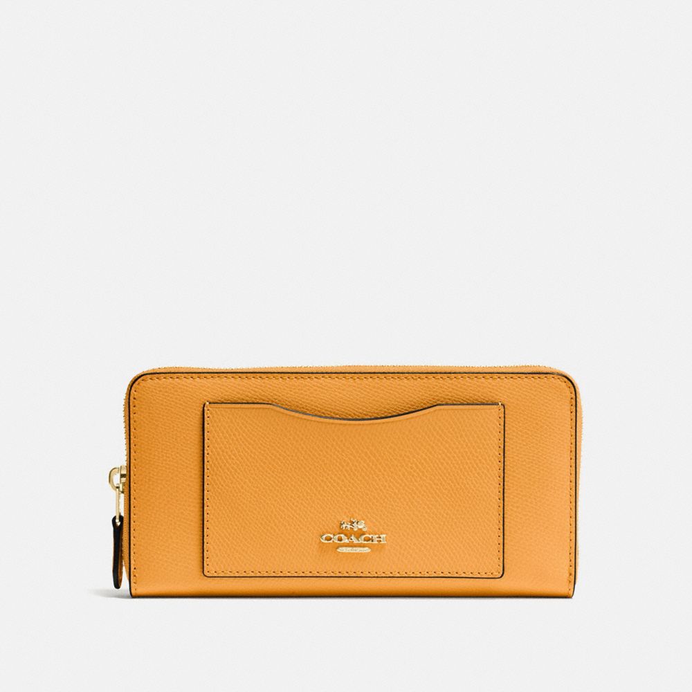 COACH Accordion Zip Wallet In Crossgrain Leather in Yellow
