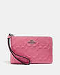 COACH®,CORNER ZIP WRISTLET IN SIGNATURE LEATHER,Leather,Mini,Silver/STRAWBERRY,Front View