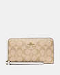 COACH®,LARGE PHONE WALLET IN SIGNATURE CANVAS,Gold/Light Khaki Chalk,Front View