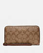 COACH®,LARGE PHONE WALLET IN SIGNATURE CANVAS,Gold/Khaki Saddle 2,Front View