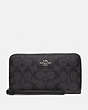 COACH®,LARGE PHONE WALLET IN SIGNATURE CANVAS,Silver/Black Smoke,Front View