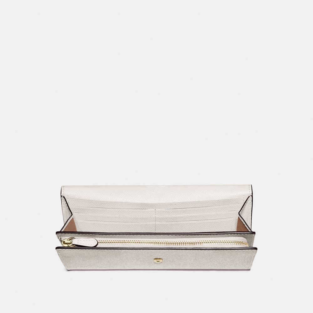 Portefeuille à enveloppe mince avec clous sur toute la surface