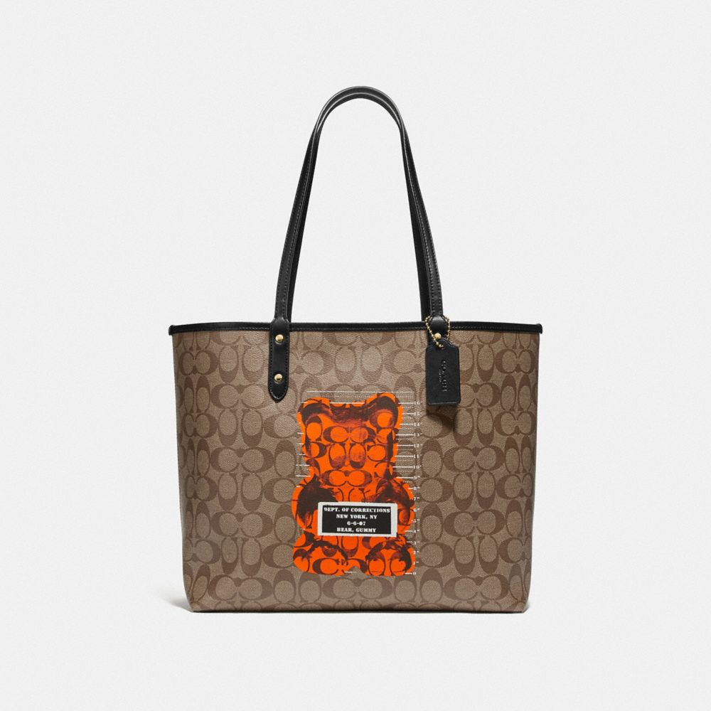 COACH Outlet Reversible City Tote In Signature Canvas With Vandal Gummy