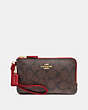 COACH®,DOUBLE CORNER ZIP WRISTLET IN SIGNATURE CANVAS,pvc,Small,Gold/Brown Ruby,Front View