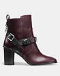 COACH®,MOTO BOOTIE HEEL,Leather,Black/Oxblood,Angle View