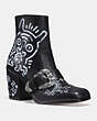 COACH®,COACH X KEITH HARING WESTERN MOTO BOOTIE,Leather,Black,Front View