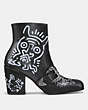 COACH®,COACH X KEITH HARING WESTERN MOTO BOOTIE,Leather,Black,Angle View