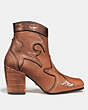 COACH®,WESTERN BOOTIE WITH BURNISH,Leather,Saddle/Bronze,Angle View