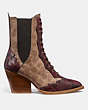 COACH®,LACE UP BOOTIE IN SIGNATURE CANVAS WITH SNAKE DETAIL,Mixed Material,Tan,Angle View