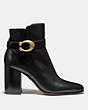 COACH®,DELANEY SIGNATURE BUCKLE HEEL BOOTIE,Leather,Black,Angle View