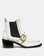 COACH®,NORA CHELSEA BOOTIE WITH STUDS,Leather,White,Angle View
