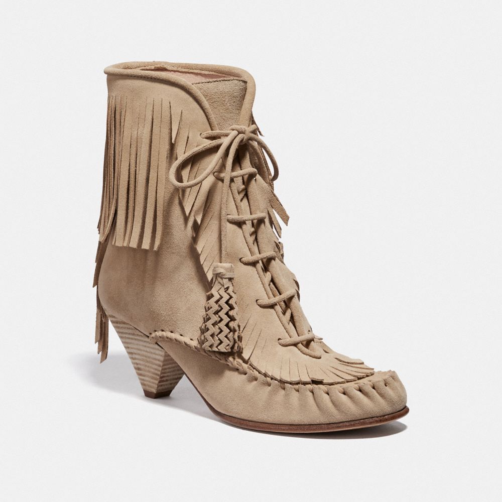 Coach lace clearance up tassle boot