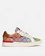 COACH®,LOWLINE LOW TOP SNEAKER IN RAINBOW SIGNATURE CANVAS,Coated Canvas,TAN MULTI,Angle View