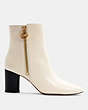 COACH®,IRIS BOOTIE,Leather,Chalk,Angle View