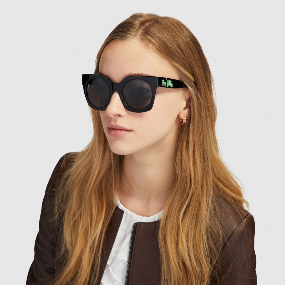 COACH®,HORSE AND CARRIAGE HOLOGRAM SUNGLASSES,Mixed Material,Black/Dark Grey Lens,Angle View