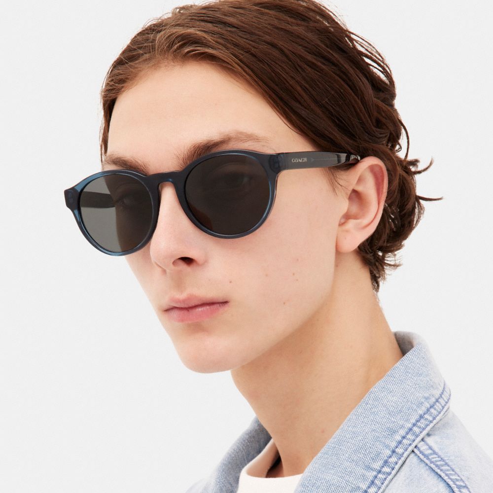 COACH®,WYTHE ROUND SUNGLASSES,Transparent Blue,Angle View