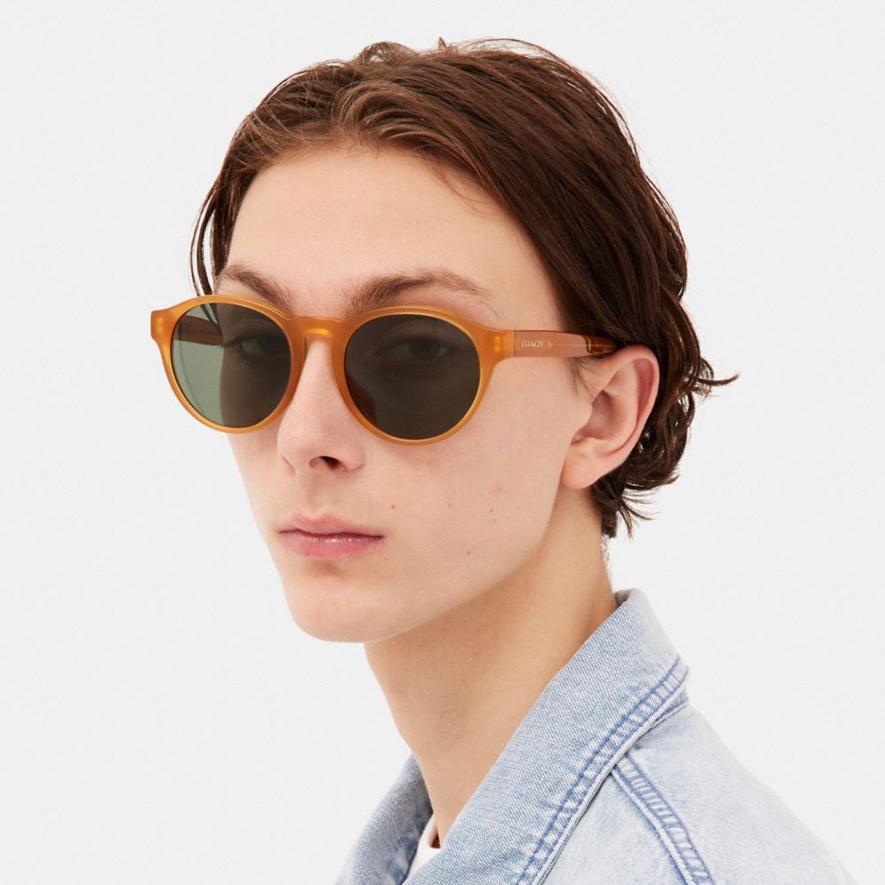 COACH®,WYTHE ROUND SUNGLASSES,Transparent Amber,Angle View